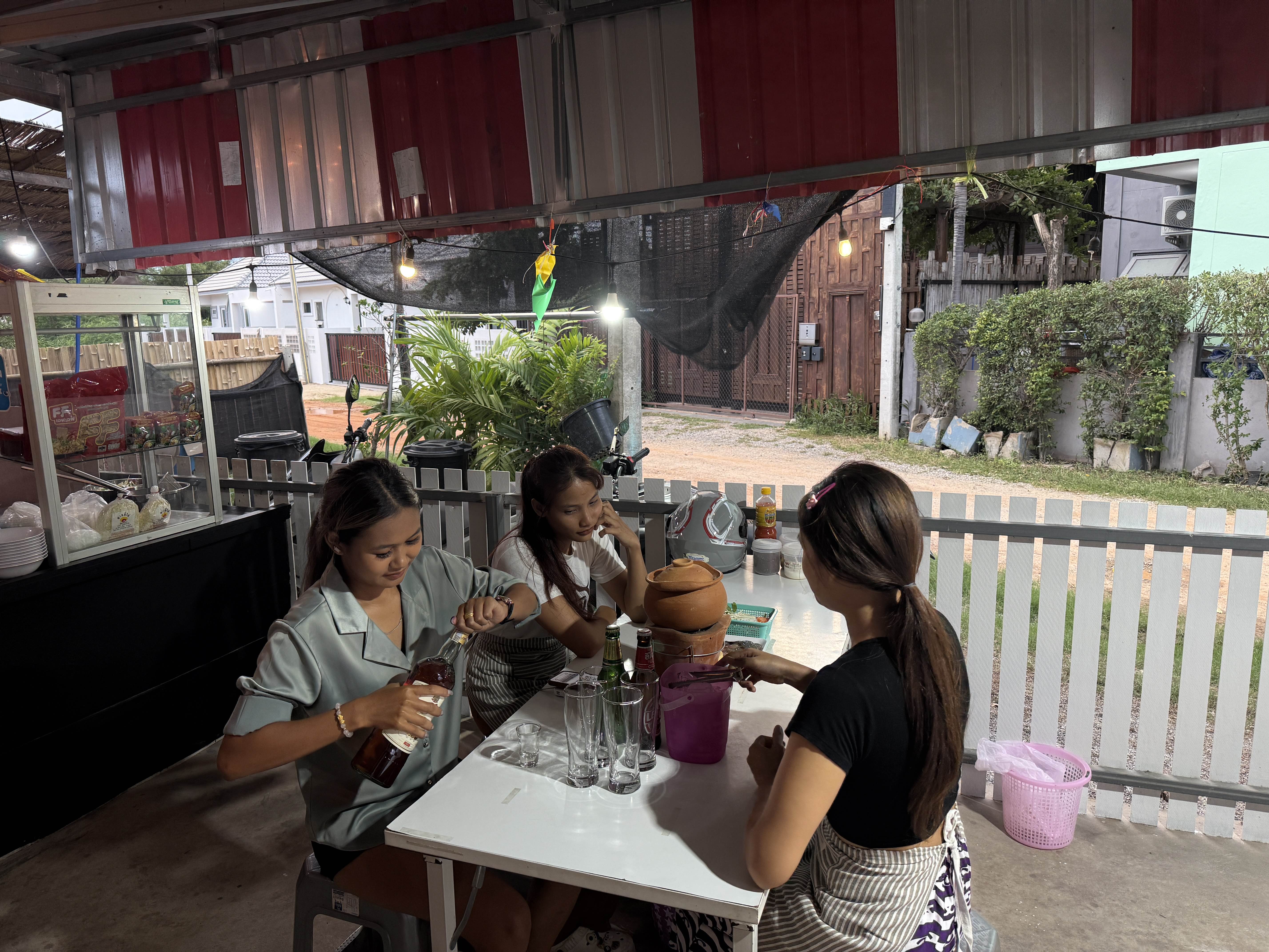 Regular height table seating with chairs under covered area